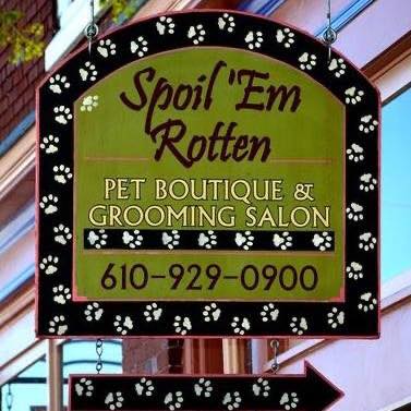 spoil em rotten pet boutique and grooming salon sign